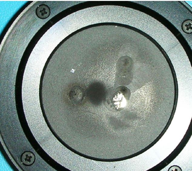 Laser measurement sensor surface damaged by laser energy density exceeding the damage threshold