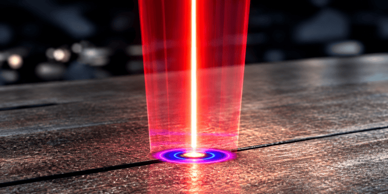 Ring/core laser beam with a bright central core and surrounding annular ring on a metal workpiece